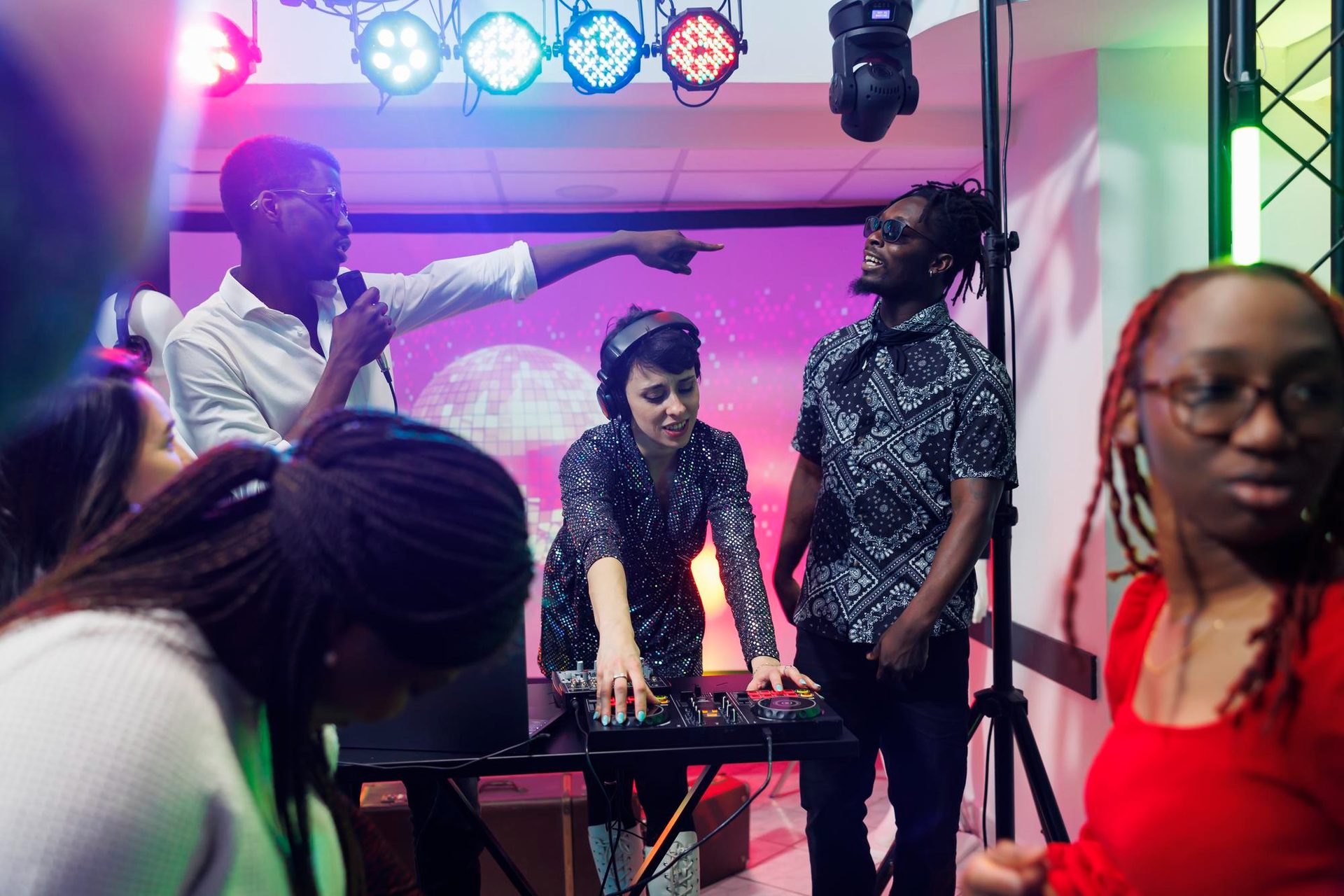 Music video shoot on an LED virtual-production stage — director framing a shot, artist mid-performance.
