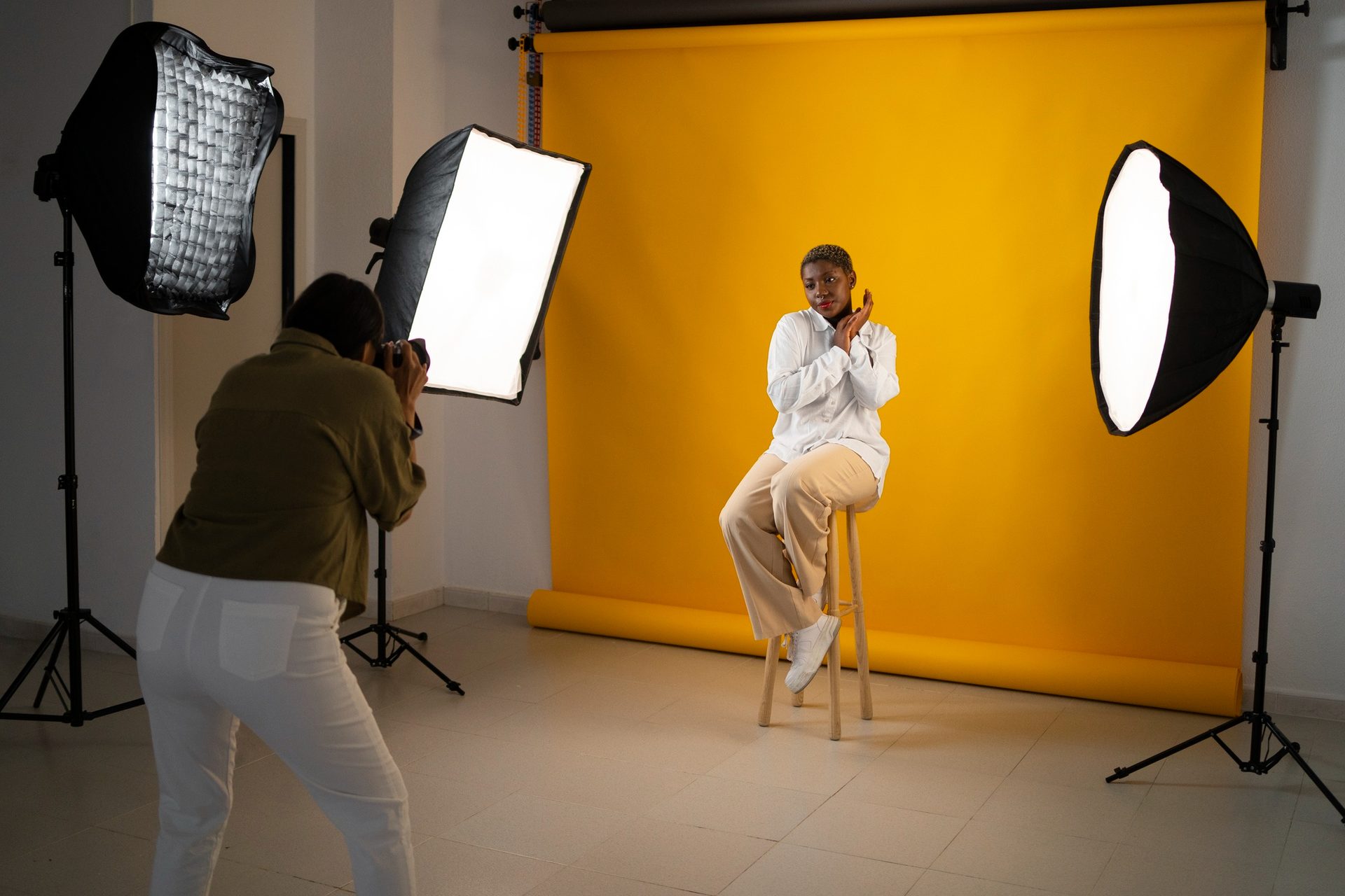 Brand campaign shoot — product and talent together, commercial lighting setup.